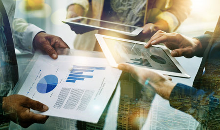 Table, people hands and digital overlay for data analytics strategy, planning or teamwork in finance...