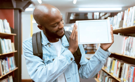 Mock up, student or black man on tablet screen for advertising, scholarship results or research review in library. Education, school or male with tech in university for internet, website or learningの写真素材