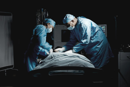 Healthcare, medical and team of surgeons doing surgery on a patient for an emergency operation in...