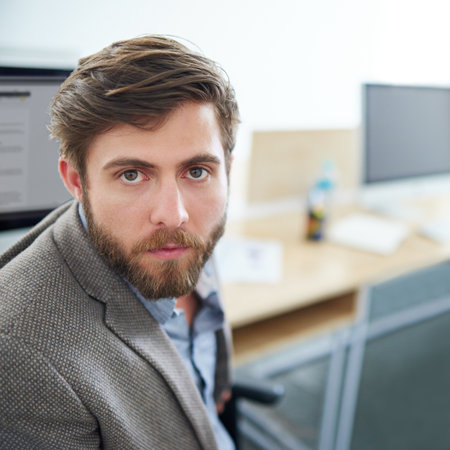 Hes serious about his work. a designer at work in an office.の写真素材