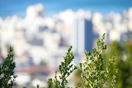 Take a vacation in paradise. a city on the coastline with mountains surrounding it.の写真素材