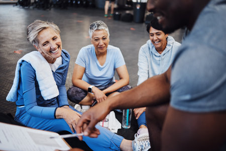 Senior women, fitness and personal trainer contract with elderly friends ready for wellness. Sports, gym and workout group with happiness and smile in a sport training gym for pilates or yogaの写真素材