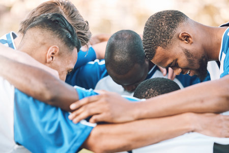 Soccer, team motivation and men huddle at sports competition or game for teamwork on a field. Football group people together for support, trust and fitness with diversity for planning strategyの写真素材