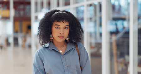Creative black woman, face and arms crossed for vision, career ambition or empowerment at the office. Portrait of African American woman employee designer with crossed arms in confidence for startupの写真素材