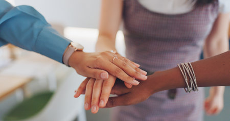 Teamwork, hands huddle and business people dance celebrating goals, targets or achievements. Team building, collaboration and happy group of friends or women dancing for success or victory in office.の写真素材