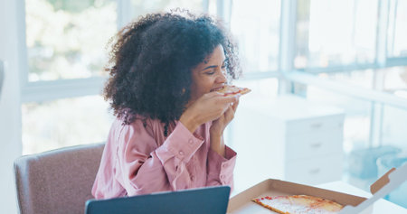 Business woman, pizza and eating in office, enjoy lunch with fast food meal and hungry while...