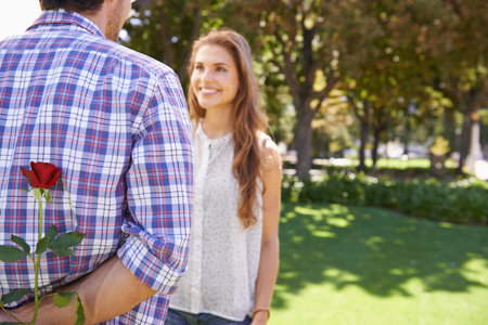 Surprise, date and man with a rose for a woman in nature for valentines day together in Australia....