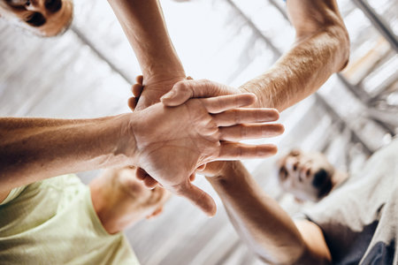 Hands, stack and fitness huddle in workout gym, training exercise or healthcare wellness bonding....