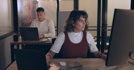 Corporate woman, night and computer for typing, reading or planning at social media marketing job....