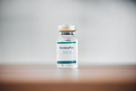 Moneypox, hospital vaccine and bottle for healthcare, medical virus and cure for disease on a table....