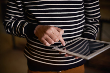 Using touchscreen technology. a hipster using a touchscreen device.