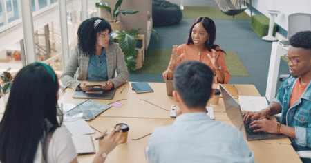 Laptop, digital marketing or creative employees in a meeting planning SEO strategy, advertising or...