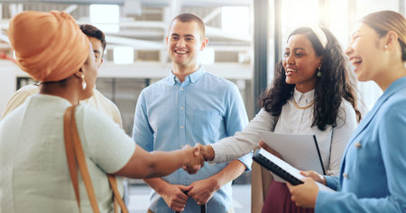 Diversity, team and handshake for partnership, business and collaboration in modern office....