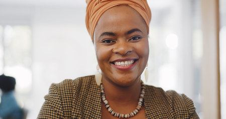 Happy, smile and face of a professional black woman with a positive mindset in a corporate office....