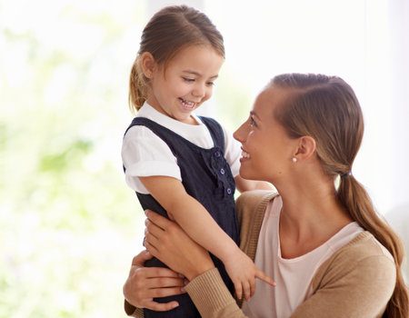 The sweetest moment. Portrait of a young mother and her little girl bonding at home.の写真素材