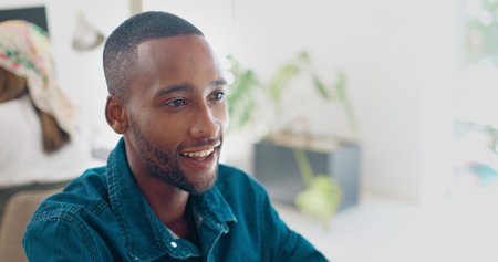 Office, face and African businessman working on feedback review of social network, customer experience or ecommerce. Website analytics, research report and media employee doing online survey analysisの写真素材