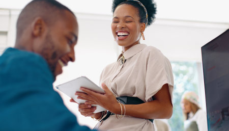 Black woman, business and laughing with man in office, agency and startup company. Happy workers, employees and team smile for funny joke, happiness and motivation of collaboration for web technologyの写真素材