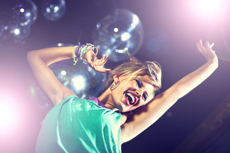 Partying the night away. an attractive and stylish young woman in a night club.