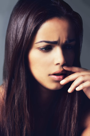 Her beauty is all natural. a beautiful young woman in the studio.