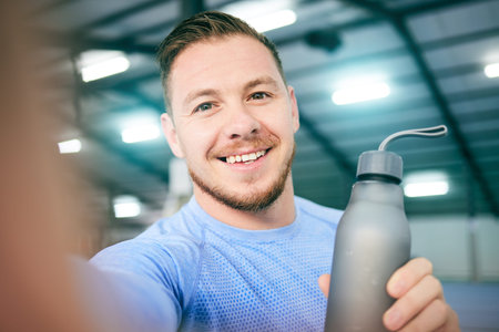 Fitness, selfie and portrait of man with water bottle at gym for training, exercise and cardio on...