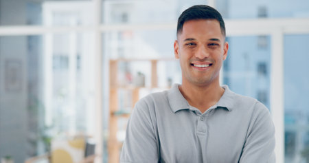 Businessman in office, face and career success, smile and happy in company headshot, leadership and vision. Leader, professional portrait and startup executive with job satisfaction and workplace.の写真素材
