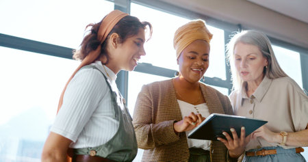 Corporate women, tablet and planning for strategy, target or marketing strategy in office for goal. Black woman coach, leader and digital tech for vision, kpi discussion or idea in digital marketingの写真素材
