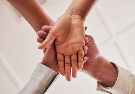 People, hands together and unity below in trust for community, agreement or teamwork at the office....
