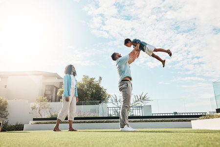 Playground, park and family outdoor in nature on a summer day on holiday with mom, dad and child. Play, fun and freedom of a mother, man and kid in the air together with love and parent careの写真素材