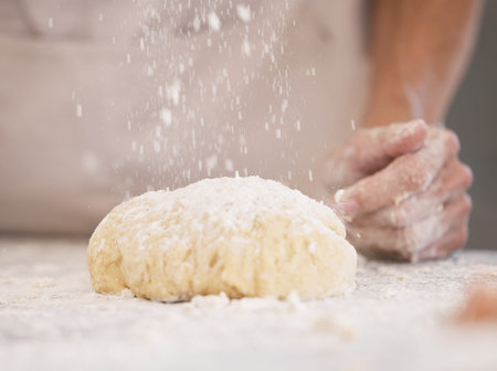 Woman hands, baking or flour sprinkle on kitchen table, countertop or desk for pastry dish, wheat...
