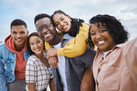 Selfie, diversity and portrait of friends on a vacation while having fun together on weekend trip. Freedom, smile and happy group of multiracial people taking a picture while on adventure on holiday.の写真素材