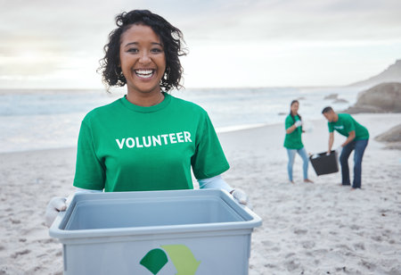 Recycle, smile and portrait of woman at beach for plastic, environment or earth day cleaning. Recycling, sustainability and climate change with volunteer and trash for pollution and eco friendlyの写真素材