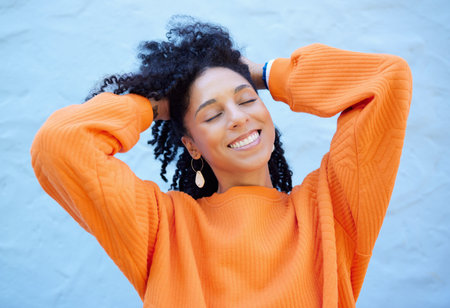 Happy, fashion and face of black woman on blue background with smile, confident mindset and freedom....