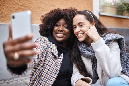 Woman, friends and selfie smile in the city for friendship memory, social media or profile picture. Happy women smiling for photo, online post or vlog in travel, journey or trip in a urban townの写真素材
