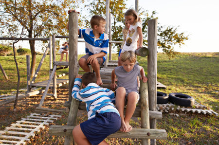Kids love being outside. kids playing on the jungle gym outdoors.