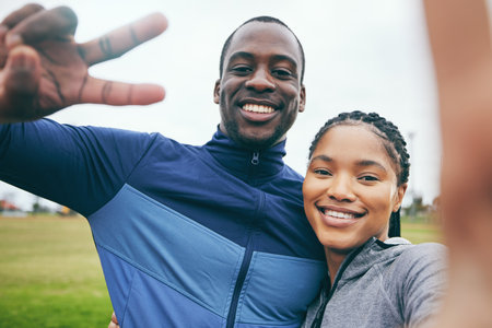 Fitness, black couple and peace sign selfie at park after exercise, training or workout in winter. Happy, v hand gesture and face portrait of man and woman taking pictures for social media or memory.の写真素材