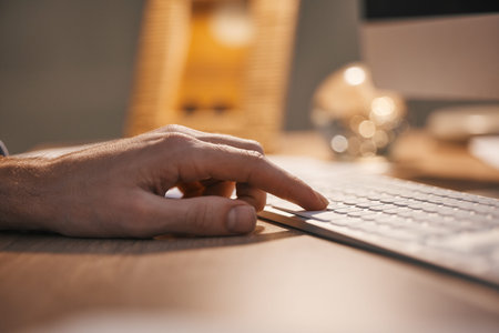 Hands, keyboard and typing at night for digital planning, strategy or online research at office...