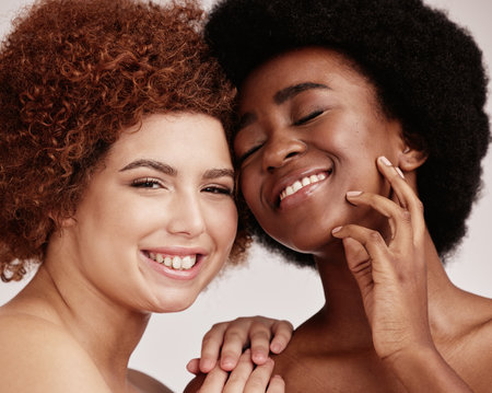 Friends, beauty inclusion with face and women happy with cosmetic care on studio background. Natural, cosmetics and hair, with diversity, healthy skin and melanin, makeup and dermatology with glowの写真素材