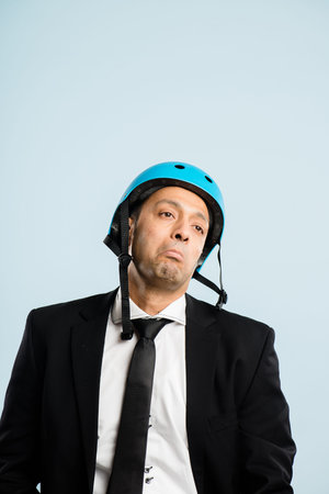Could be worse. a handsome young businessman sitting alone in the studio and posing while wearing a...