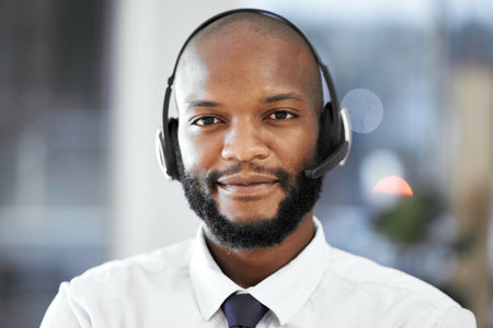 Customer support consulting, face portrait and black man telemarketing on contact us call center. Receptionist telecom, e commerce CRM or information technology consultant on microphone communicationの写真素材