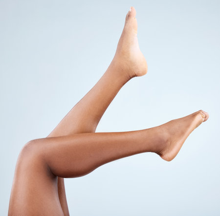Let me tell you a story about beautiful long legs. a woman showing off her smooth legs.の写真素材