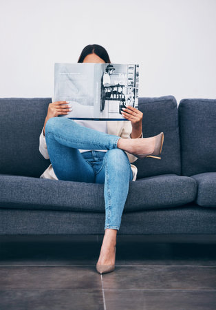 Relax, magazine or girl reading newspaper articles on sofa at home for information or story updates....