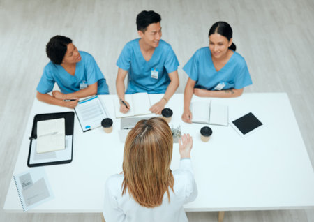 What do you like about this environment. High angle shot of a group of doctors having a meeting.の写真素材