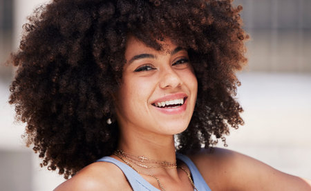 Beauty, smile and portrait of a happy black woman with an afro with a positive, good and optimistic...