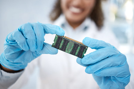 Microchip, tracker or motherboard in hands of engineer or electronics expert working on electric...