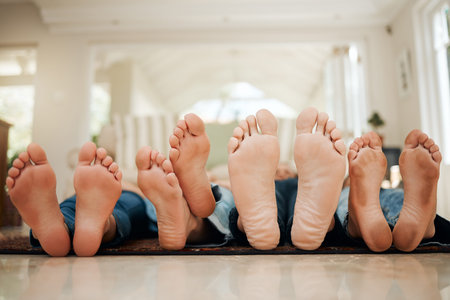 Take some time to smell the roses. a family lying down.