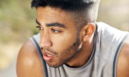 I really pushed myself today. a man resting during his workout.の写真素材