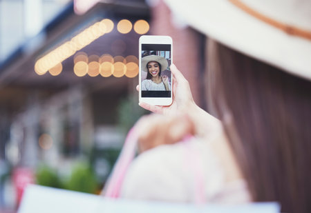 Selfie, screen and woman outdoor, summer vacation and traveling for break, getaway and photo for social media. Female, tourist and lady with smartphone, picture and connection with smile and in cityの写真素材