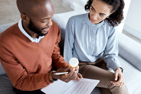 Therapy pills, mental health and woman with depression, trauma or stress with psychologist. Person talking to black man therapist for psychology and anxiety prescription medicine for help or supportの写真素材