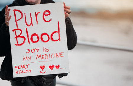 I trust my immune. system. Cape Town, South African - October 2, 2021 Unrecognisable demonstrators holding up signs and protesting against the Covid 19 vaccine.の写真素材