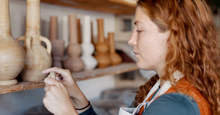 Pottery, woman artist and shelf for ceramic cups for shop, check quality for creative class or...